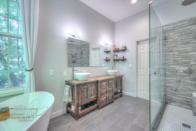 114 Moonlight Dr, Gallatin, TN 37066 - bathroom featuring a stall shower, baseboards, and plenty of natural light