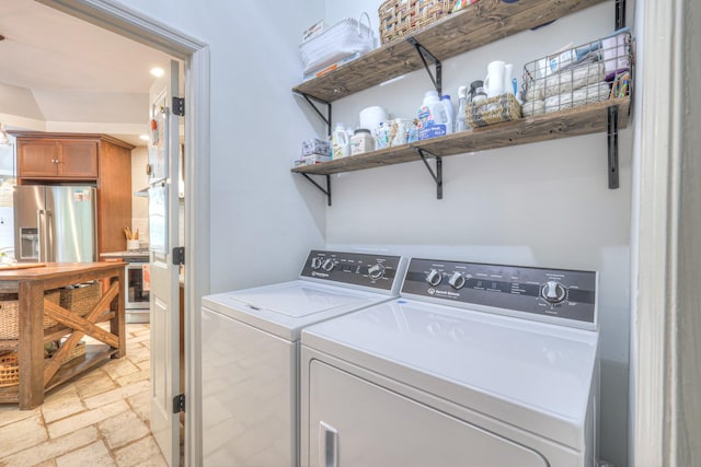 114 Moonlight Dr, Gallatin, TN 37066 - laundry room with independent washer and dryer, stone tile flooring, and recessed lighting