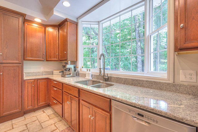 114 Moonlight Dr, Gallatin, TN 37066 - kitchen with dishwasher, a sink, stone tile flooring, brown cabinetry, and recessed lighting