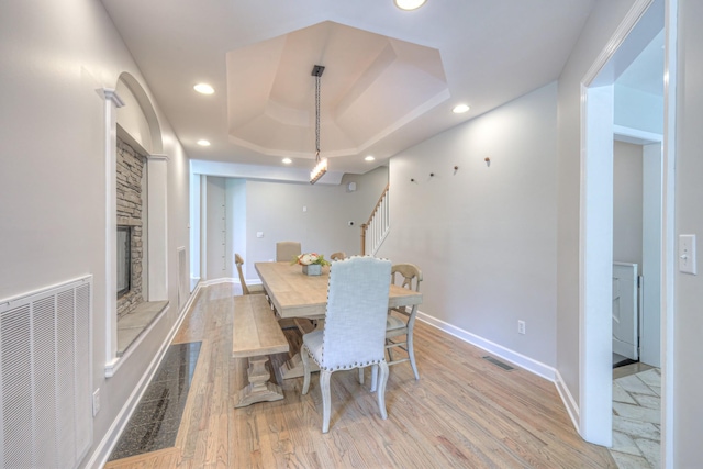 114 Moonlight Dr, Gallatin, TN 37066 - dining area with stairway, a stone fireplace, light wood-type flooring, baseboards, and recessed lighting