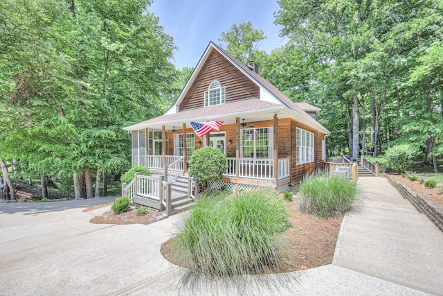 114 Moonlight Dr, Gallatin, TN 37066 - chalet / cabin featuring a porch, a chimney, roof with shingles, and ceiling fan