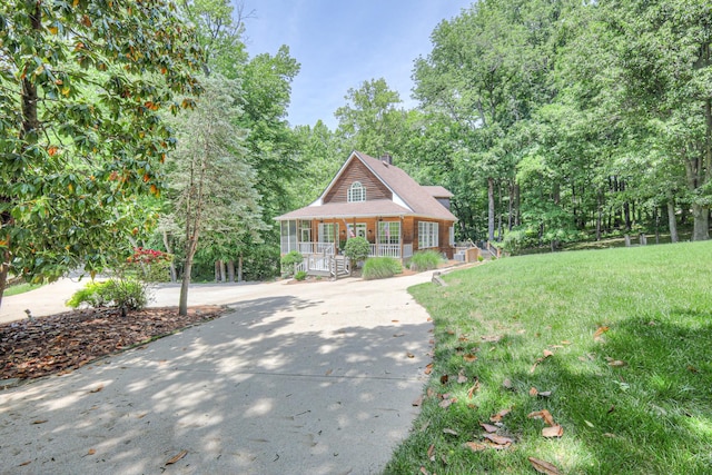 114 Moonlight Dr, Gallatin, TN 37066 - view of front of property featuring covered porch, a front yard, and a chimney