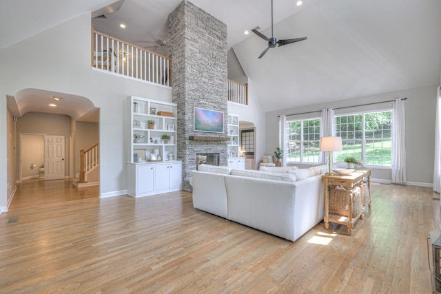 114 Moonlight Dr, Gallatin, TN 37066 - living area featuring ceiling fan, high vaulted ceiling, light wood finished floors, a fireplace, and baseboards