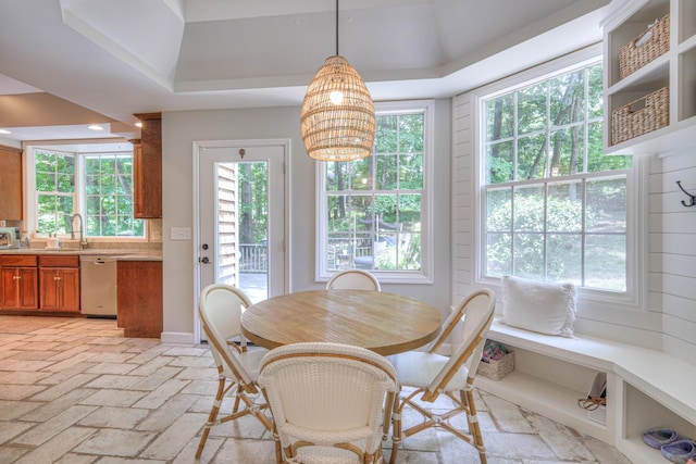 114 Moonlight Dr, Gallatin, TN 37066 - dining area featuring healthy amount of natural light, a chandelier, baseboards, and a raised ceiling