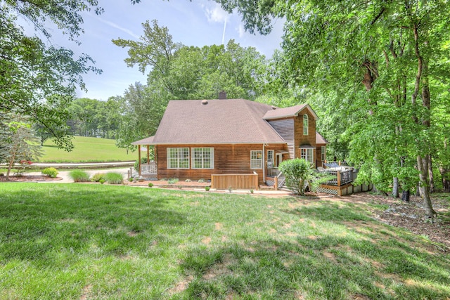 114 Moonlight Dr, Gallatin, TN 37066 - rear view of house featuring a lawn, a chimney, and a wooden deck