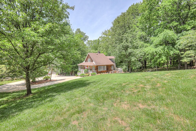 114 Moonlight Dr, Gallatin, TN 37066 - view of front of house featuring a front lawn, a chimney, and a shingled roof