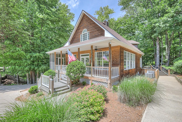 114 Moonlight Dr, Gallatin, TN 37066 - view of front of property with a ceiling fan, covered porch, a shingled roof, and a chimney