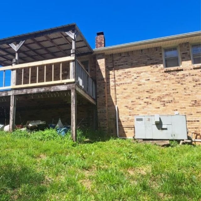 622 Beech St, Centerville, TN 37033 - view of side of property with a chimney and brick siding