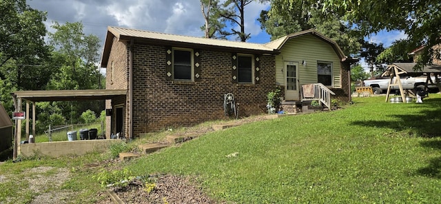 10172 W Oak Dr, Bon Aqua, TN 37025 - back of house featuring brick siding, a yard, and metal roof