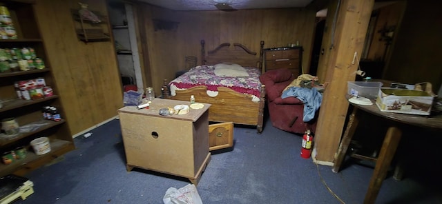 10172 W Oak Dr, Bon Aqua, TN 37025 - bedroom with wood walls and dark carpet