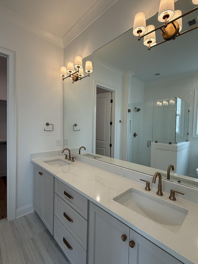3150 Long Branch Cir, Franklin, TN 37064 - full bath featuring a chandelier, a shower stall, crown molding, and double vanity
