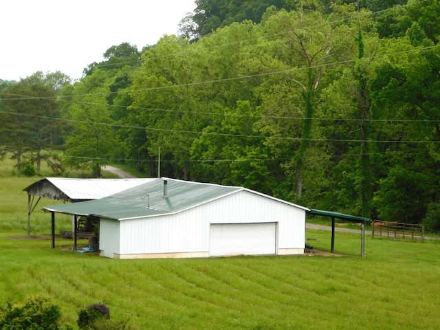 1760 Camp Branch Rd, Mount Pleasant, TN 38474 - garage with a detached garage and a forest view