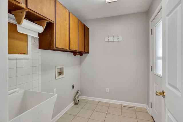 1760 Camp Branch Rd, Mount Pleasant, TN 38474 - laundry room featuring hookup for an electric dryer, hookup for a washing machine, cabinet space, light tile patterned floors, and baseboards