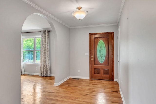 1760 Camp Branch Rd, Mount Pleasant, TN 38474 - entryway featuring arched walkways, light wood-type flooring, baseboards, and ornamental molding