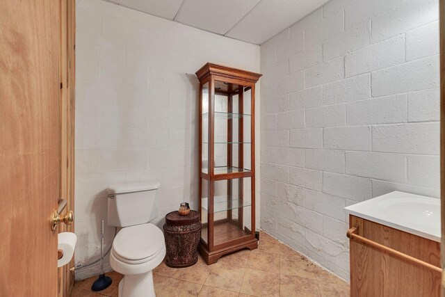 1760 Camp Branch Rd, Mount Pleasant, TN 38474 - bathroom featuring toilet, vanity, and concrete block wall