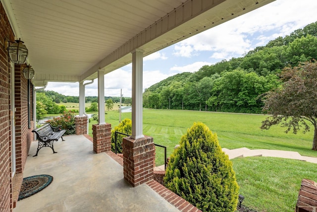 1760 Camp Branch Rd, Mount Pleasant, TN 38474 - covered porch featuring a yard