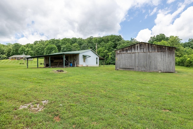 1760 Camp Branch Rd, Mount Pleasant, TN 38474 - view of grassy yard with a pole building and an outdoor structure