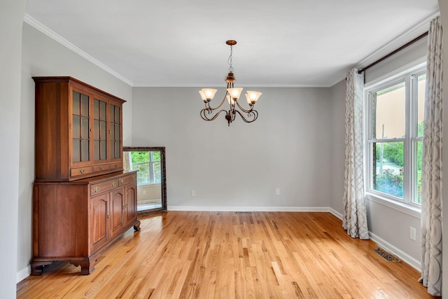 1760 Camp Branch Rd, Mount Pleasant, TN 38474 - unfurnished dining area featuring a chandelier, light wood-type flooring, baseboards, and crown molding