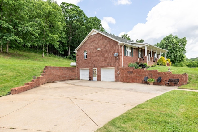 1760 Camp Branch Rd, Mount Pleasant, TN 38474 - view of home's exterior with brick siding, a yard, driveway, and a garage