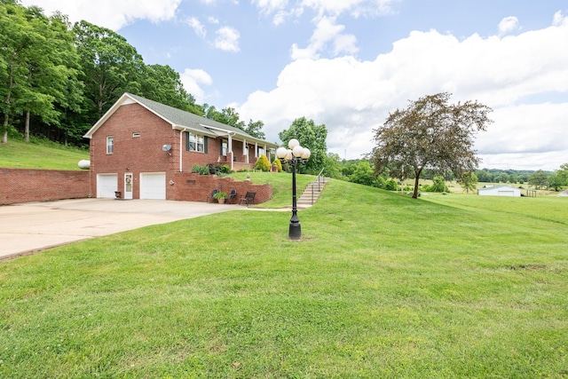 1760 Camp Branch Rd, Mount Pleasant, TN 38474 - view of front of home featuring brick siding, an attached garage, driveway, and a front lawn