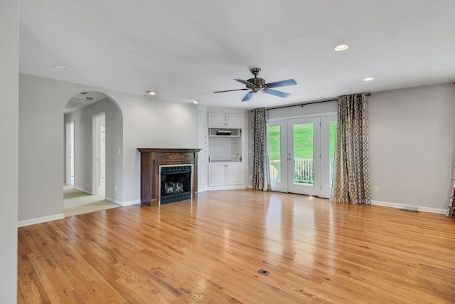 1760 Camp Branch Rd, Mount Pleasant, TN 38474 - unfurnished living room with a ceiling fan, arched walkways, recessed lighting, light wood finished floors, and a fireplace