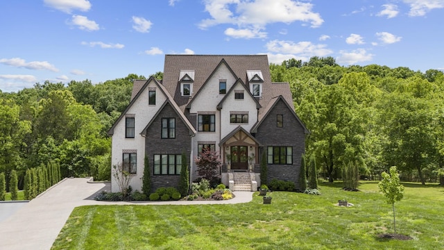 302 Cedar Hollow Ct, Lebanon, TN 37087 - view of front of property with a front lawn, stone siding, and a forest view