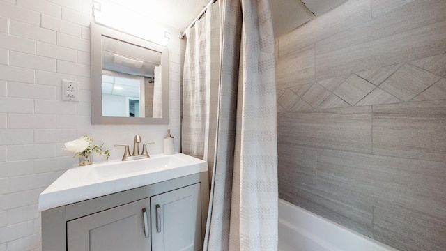1304 Cheshire Dr, Nashville, TN 37207 - full bathroom featuring vanity, tile walls, and shower / bath combination with curtain