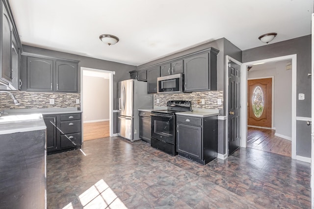 807 Sugarcane Way, Clarksville, TN 37040 - kitchen featuring stainless steel appliances, tasteful backsplash, light countertops, baseboards, and a sink