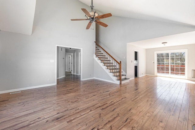 807 Sugarcane Way, Clarksville, TN 37040 - unfurnished living room with stairway, ceiling fan, wood finished floors, high vaulted ceiling, and baseboards
