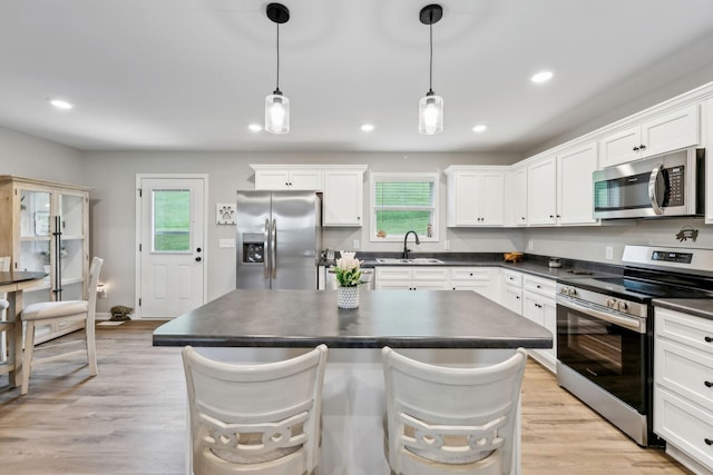2955 Spring Place Rd, Belfast, TN 37019 - kitchen with appliances with stainless steel finishes, dark countertops, a sink, and recessed lighting