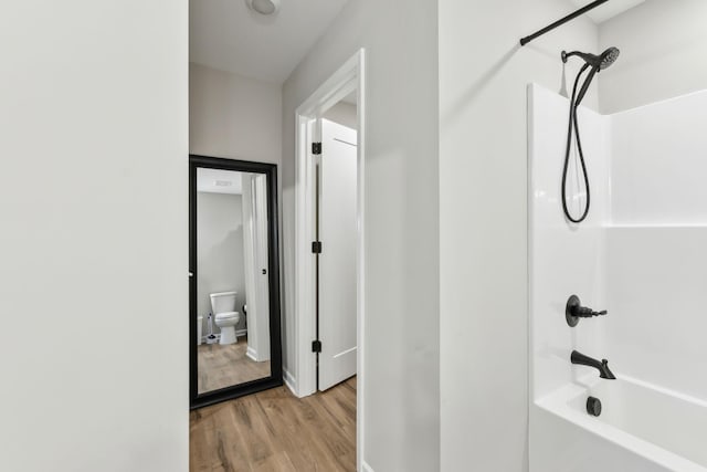 2955 Spring Place Rd, Belfast, TN 37019 - full bath with toilet, wood finished floors, shower / bathtub combination, and baseboards