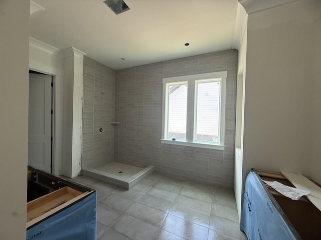 7424 Leelee Dr, Franklin, TN 37064 - bathroom with tile patterned floors, tile walls, and a tile shower