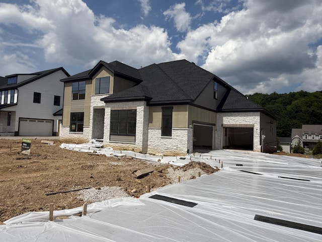 7424 Leelee Dr, Franklin, TN 37064 - contemporary house with stone siding, a garage, and driveway