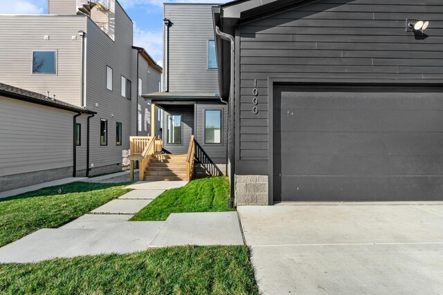 view of front of home with driveway and an attached garage
