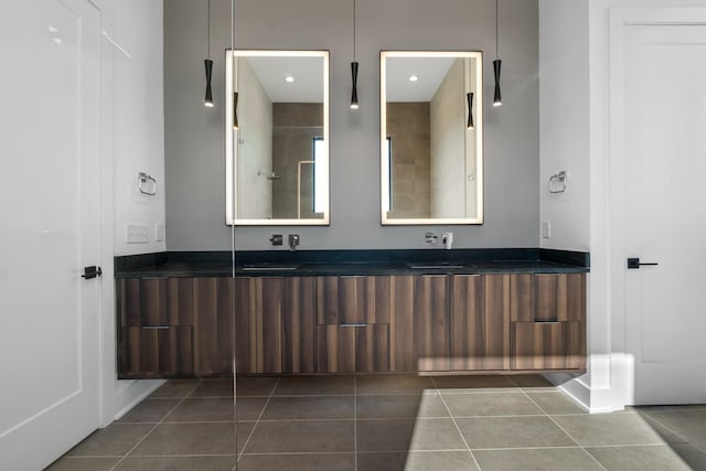 full bathroom with tile patterned floors and double vanity