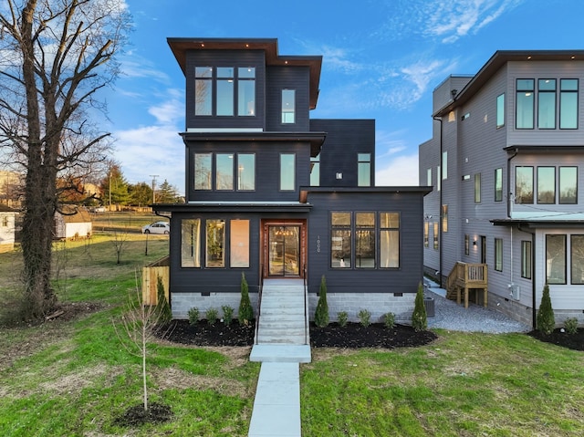 contemporary home with crawl space and a front lawn