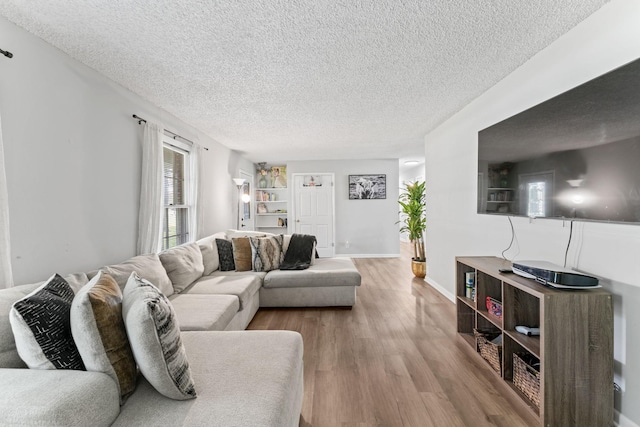 211 Elmwood Dr, Murfreesboro, TN 37128 - living room with a textured ceiling, wood finished floors, and baseboards