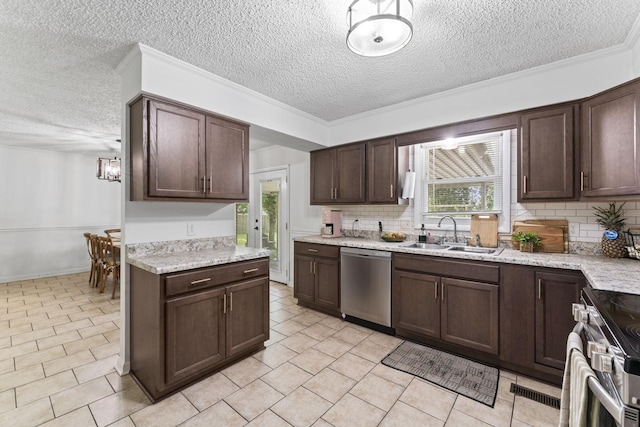 211 Elmwood Dr, Murfreesboro, TN 37128 - kitchen with stainless steel appliances, a sink, a textured ceiling, plenty of natural light, and tasteful backsplash