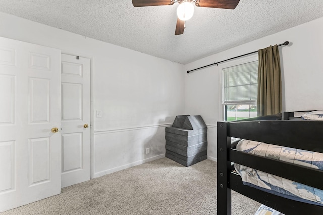 211 Elmwood Dr, Murfreesboro, TN 37128 - carpeted bedroom with a textured ceiling, ceiling fan, and baseboards