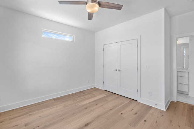 unfurnished bedroom featuring light wood-style floors, baseboards, a closet, and a ceiling fan
