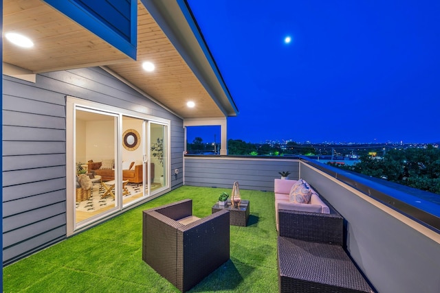 balcony at night with an outdoor living space