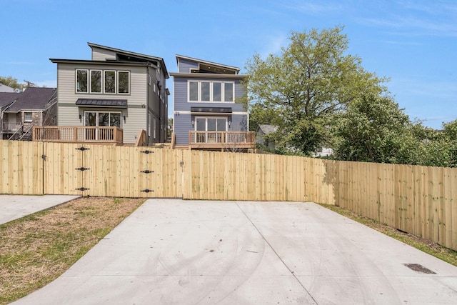 view of patio with a gate and a fenced front yard
