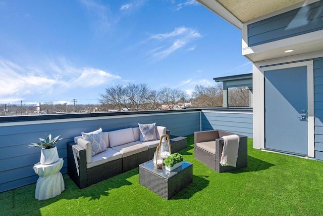 view of grassy yard with outdoor lounge area