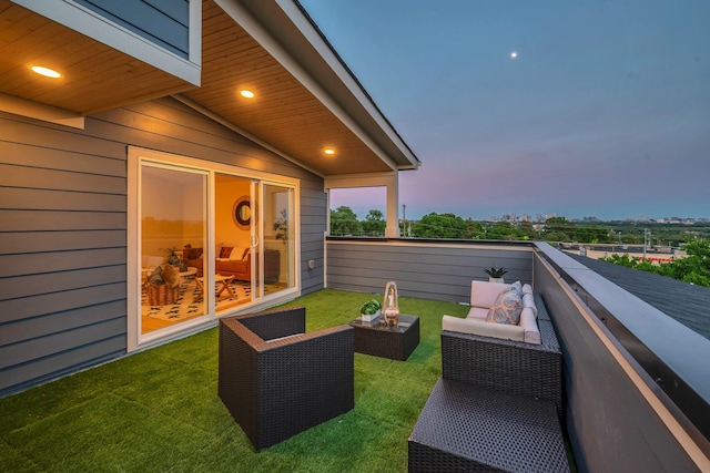 view of balcony at dusk