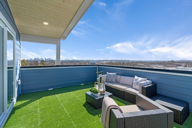 balcony featuring an outdoor hangout area and a view of city