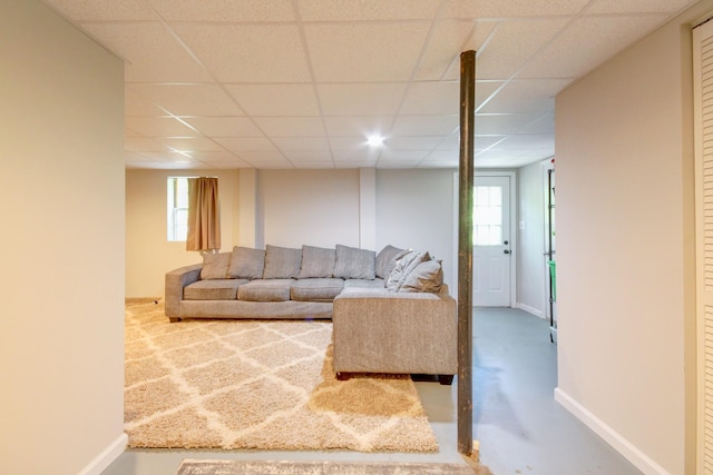 2878 Gusty Ln, Clarksville, TN 37043 - living area with a paneled ceiling, baseboards, plenty of natural light, and finished concrete flooring