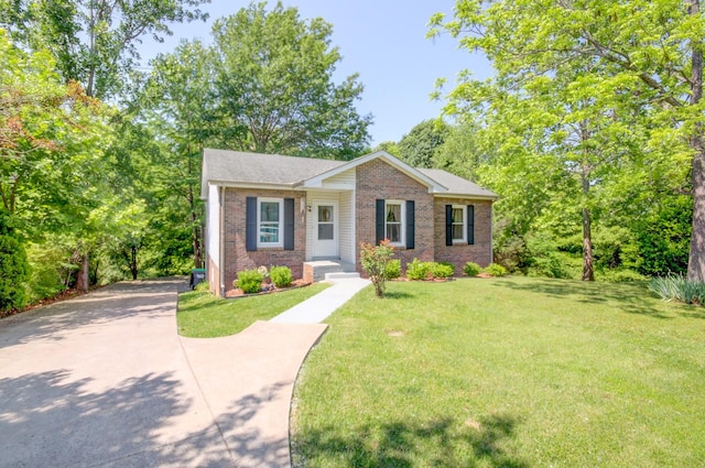 2878 Gusty Ln, Clarksville, TN 37043 - view of front of property featuring brick siding, a front yard, and driveway