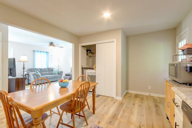 2878 Gusty Ln, Clarksville, TN 37043 - dining space featuring light wood-style floors, healthy amount of natural light, a ceiling fan, and baseboards