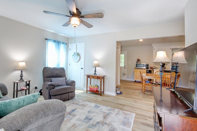 2878 Gusty Ln, Clarksville, TN 37043 - living area featuring a ceiling fan, light wood-type flooring, and baseboards