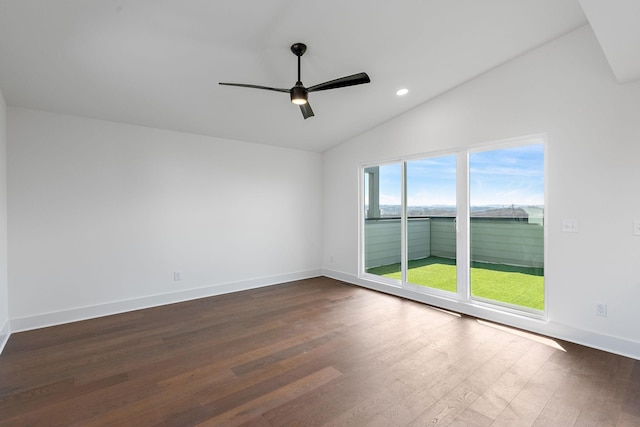 empty room with vaulted ceiling, dark wood-style floors, ceiling fan, recessed lighting, and baseboards